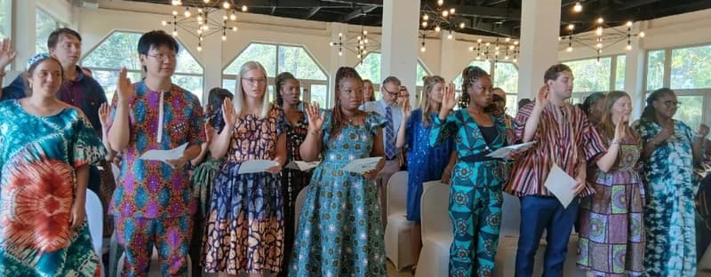 The new cohort of US Peace Corps Volunteers being sworn in