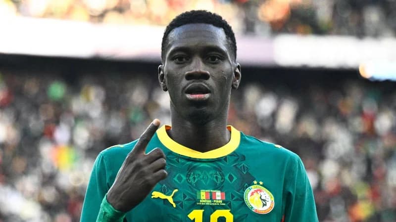 Senegal's Ismaila Sarr celebrates after scoring in a friendly against Peru