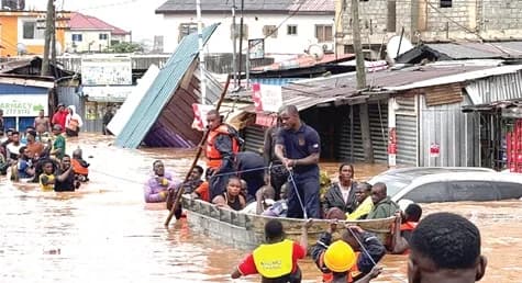 Some officials of NADMO and the 48 Engineer Regiment of the Ghana Armed Forces, on rescue operation in flood-affected areas