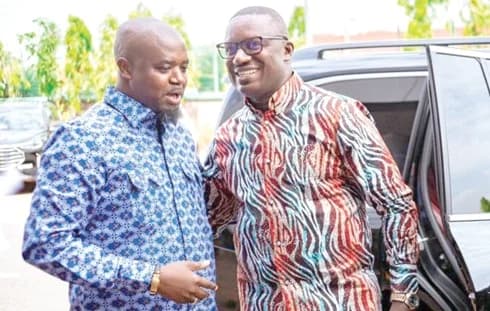 Dr John Abdulai Jinapor (left), Minister of Energy and Green Transition, confering with Godwin Kudzo Tameklo, Chief Executive of the National Petroleum Authority