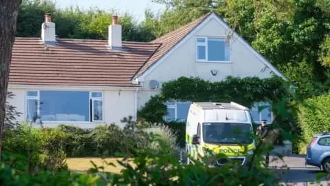 PA Media Police outside the house of Ann Widdecombe in Haytor in Dartmoor. A police van parked on the driveway