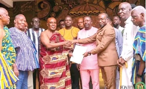 Nana Takyi Firi (3rd from left), Krontihene of the Techiman Traditional Council, presenting the signed document to Francis Owusu Antwi, Bono East Regional Minister