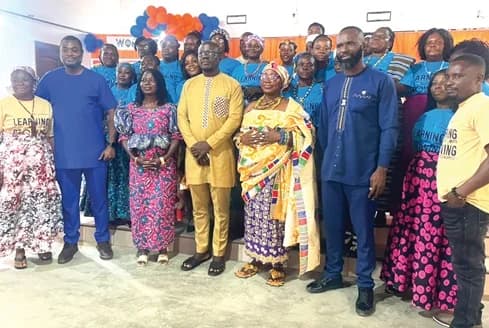 Kafui Duho (2nd from left), Executive Director, Women's Trust, with some dignitaries and graduates after the ceremony
