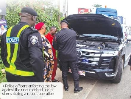 Police officers enforcing the law against the unauthorised use of sirens during a recent operation