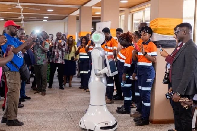 A robot developed at the AngloGold Ashanti Iduapriem Smart Systems Centre is displayed by students of the University of Mines and Technology (UMaT) during the commissioning of the facility in Tarkwa