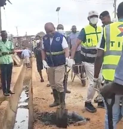 Wilbert Petty Brentum (arrowed), Western North Regional Minister, participating in a clean-up exercise in Enchi