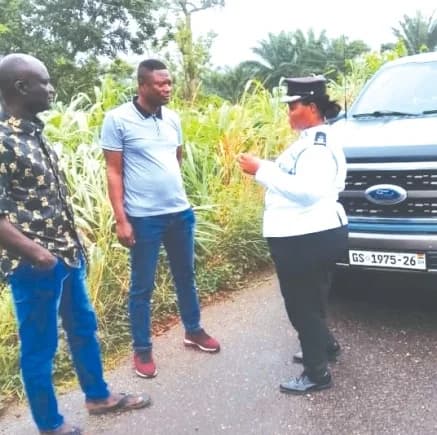 Chief Superintendent Benedicta Akpene Ansah, Volta Regional MTTD Commander explaining a point to two occupants of vehicles intercepted during the exercise