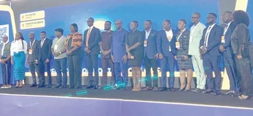 Shaibu Haruna (9th from right), Chief Executive Officer of MoMo Fintech Limited, with Owureku Asare (7th from left), Head of Fintech Regulations, Bank of Ghana, and other participants