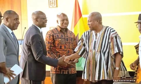 President John Dramani Mahama (right) exchanging pleasantries with Dr Cassiel Ato Forson (left), Minister of Finance and committee Chair