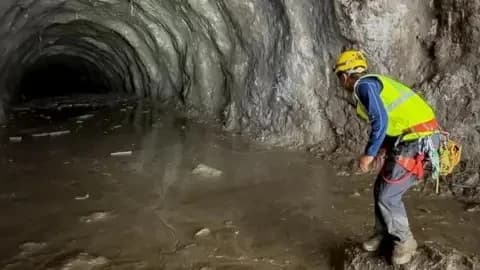 Reuters A rescuer works at the entrance of a tunnel at Chilime Hydropower Plant as rescue operations continue for people trapped inside following deadly flash floods and a mudslide, in Rasuwa, Nepal.