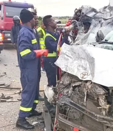 Some members of the extrication team from the Ghana National Fire Service rescuing some of the accident victims