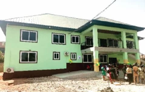 The 2-storey maternity block and accommodation for Amahyia Community Health Centre. inset: Ella Esinam Christine Nongo, Municipal Chief Executive for Adentan, inaugurating the health facility