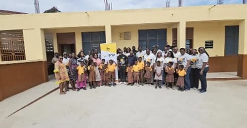 Employees of GCB and pupils of the Oblogo M/A Basic School
