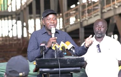 Mahama Ayariga, Minister of Local Government, Chieftaincy and Religious Affairs, speaking at the event, while Richard Ofori-Agyeman Boadi, KMA Chief Executive, looks on