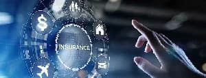 A digital interface featuring a glowing circular menu with the word 'INSURANCE' at its center. A human hand is shown interacting with the various icons surrounding the text, including symbols for travel (airplane), finance (dollar sign), and housing.
