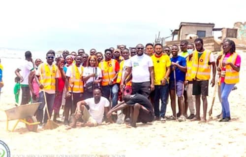 Officials of the Africa Centre for Nature-Based Climate Action with participants after the clean up exercise at the Chorkor beach