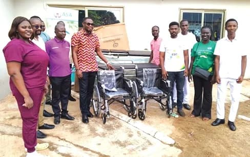 Executive members of ASA Savings and Loans with parents and students after the donation