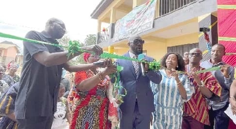 John Desmond Sowah Nai (left), MCE for Ga West, commissioning the two-storey, six-unit classroom block at Manhean. With him is Sedem Kweku Afenyo (right), MP for Amasaman Constituency