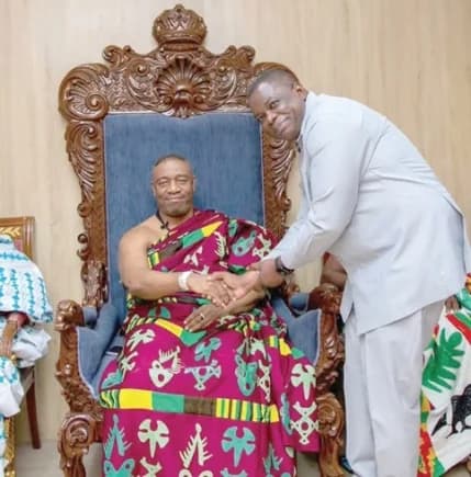 King Tackie Teiko Tsuru II ( seated), Ga Mantse, welcoming Governs Agbodza, Minister of Roads and Highways, to his palace