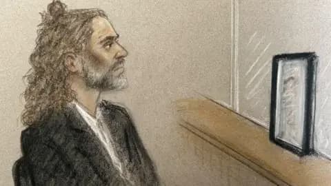 Julia Quenzler Court artist sketch of Russell Brand in the dock on 15 October, during trial at Southwark Crown Court, where he faces three charges of rape, indecent assault, and three counts of sexual assault, relating to six women