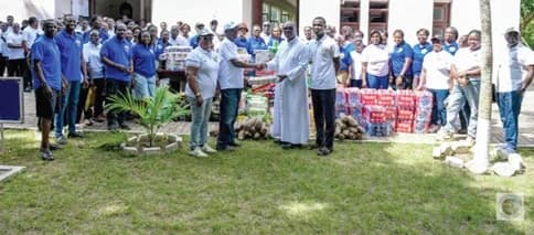 Francis K Oppong, President of the Holy Family Akankuo of the parish, presenting the items to Very Rev. Francis Arthur, former Rector of St. Paul's Seminary.